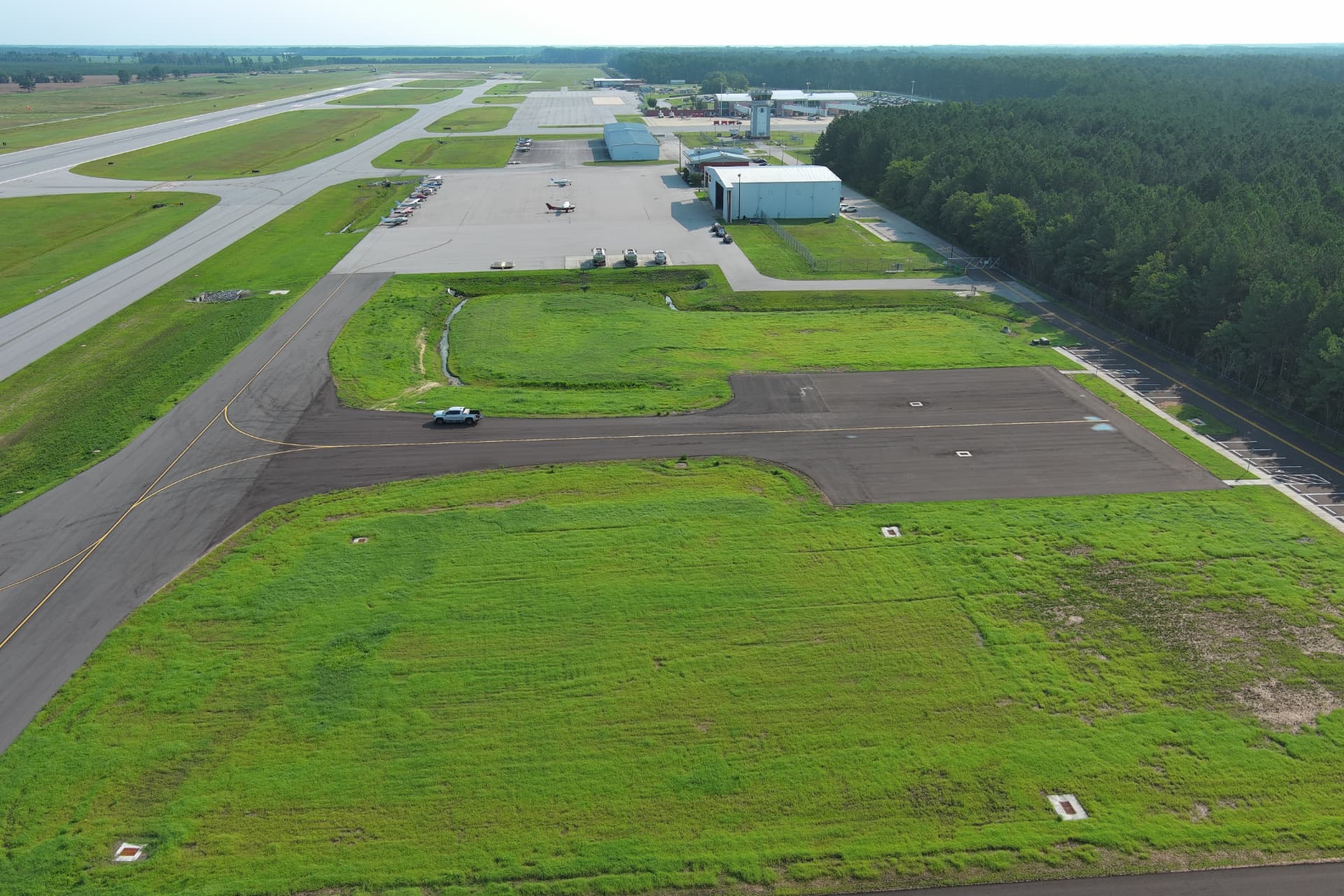 Aerial view of the Albert J. Ellis Airport apron, hangars, and terminal