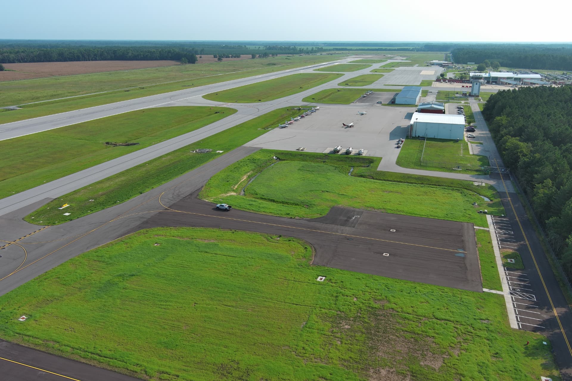 Aerial view of the Albert J. Ellis Airport runway, taxiways, and terminal area