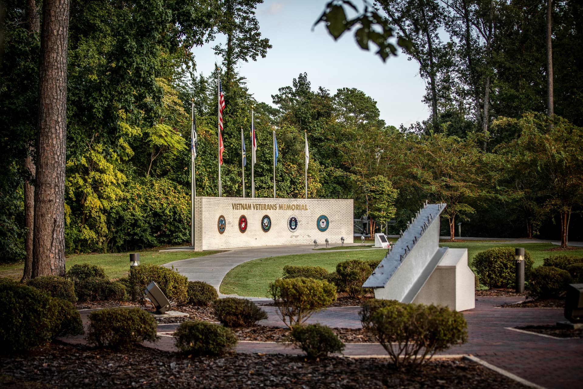 Vietnam Veterans Memorial wall and the 9/11 steel beam memorial at Lejeune Memorial Gardens