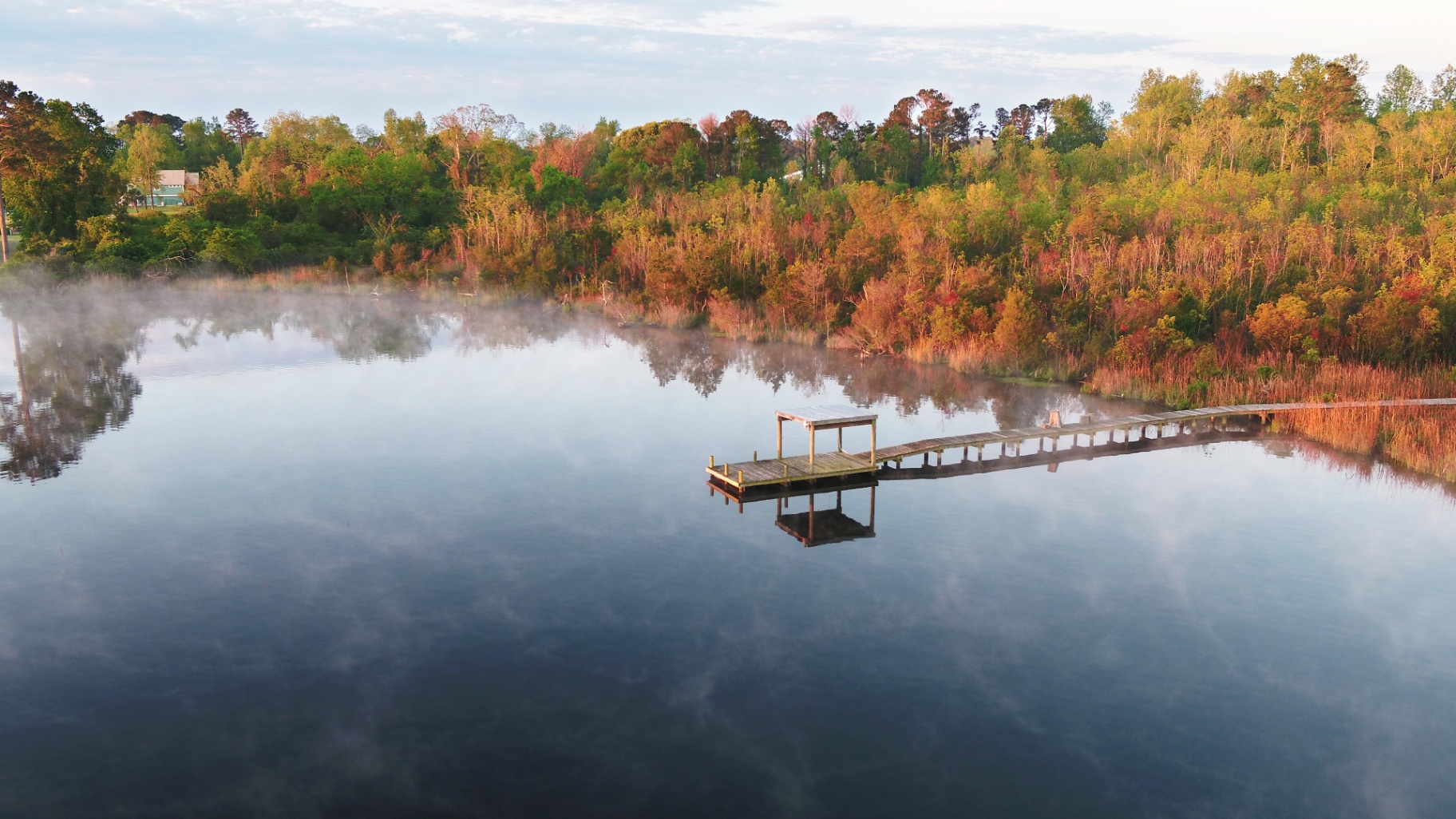 Serene boardwalk on a calm Onslow County waterway