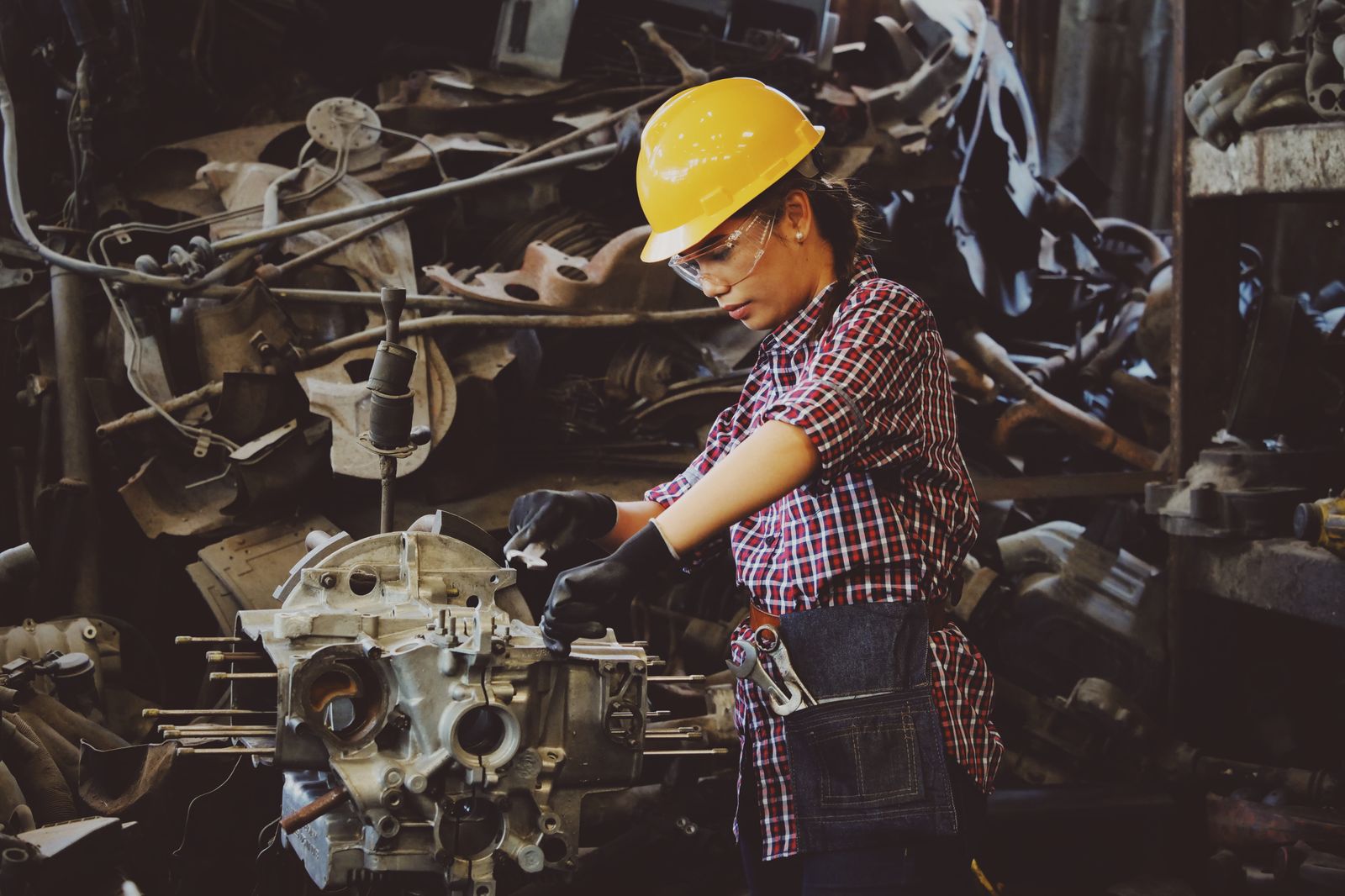 Skilled machinist working on precision equipment in an Onslow County shop